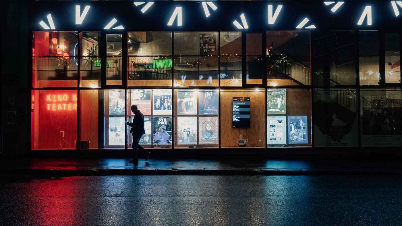 Illustration photo, of a Cinema that is also Theater. Window with film and performance posters. 
